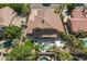 Tile roof home with covered patio, private pool, and lush landscaping create an outdoor oasis at 1808 S Sailors Way, Gilbert, AZ 85295