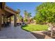 Inviting backyard with a covered patio, outdoor seating, and well-maintained landscaping at 1808 S Sailors Way, Gilbert, AZ 85295