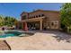 Expansive backyard featuring a pool, covered patio, and outdoor seating at 1808 S Sailors Way, Gilbert, AZ 85295