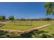 Community baseball field with backstop, providing an athletic space for games and activities in a green park setting at 1808 S Sailors Way, Gilbert, AZ 85295