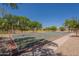 Community basketball court with painted lines and hoops, perfect for sports and outdoor recreation for all ages at 1808 S Sailors Way, Gilbert, AZ 85295
