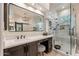 Modern bathroom with granite counters, dark wood cabinets, and glass-enclosed shower at 1808 S Sailors Way, Gilbert, AZ 85295