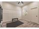 Bedroom featuring a ceiling fan, white walls, a window, and exercise equipment at 1808 S Sailors Way, Gilbert, AZ 85295