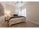 Bright bedroom boasts a decorative rug, neutral walls, and a bed with drawer storage at 1808 S Sailors Way, Gilbert, AZ 85295