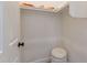 Small, walk-in closet with top shelf and a cushioned seat at 1808 S Sailors Way, Gilbert, AZ 85295