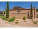Whispering Pines community sign nestled among mature trees and landscaping, creating a welcoming entrance at 1808 S Sailors Way, Gilbert, AZ 85295