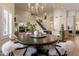 Spacious dining area connected to the kitchen, featuring modern furniture and natural light at 1808 S Sailors Way, Gilbert, AZ 85295