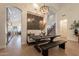 Dining area showcases a large table and bench, stylish lighting, and access to other living spaces at 1808 S Sailors Way, Gilbert, AZ 85295
