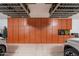 Well-organized garage with extensive custom cabinetry, overhead storage racks, and space for multiple vehicles at 1808 S Sailors Way, Gilbert, AZ 85295