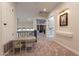 Hallway with carpet and small table with chairs near black railing at 1808 S Sailors Way, Gilbert, AZ 85295