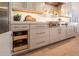 This updated kitchen features custom cabinets with convenient pull out drawers for easy storage at 1808 S Sailors Way, Gilbert, AZ 85295