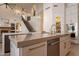 Kitchen island featuring stainless steel appliances, custom cabinetry, and an open layout perfect for modern living at 1808 S Sailors Way, Gilbert, AZ 85295