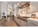 Modern kitchen featuring professional-grade appliances, custom cabinetry, and sleek countertops with subway tile backsplash at 1808 S Sailors Way, Gilbert, AZ 85295