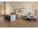 Bright, open kitchen with stainless steel appliances, center island, and adjacent dining area at 1808 S Sailors Way, Gilbert, AZ 85295