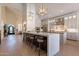 Large kitchen with island seating, stainless appliances, pendant lights, and open floor plan at 1808 S Sailors Way, Gilbert, AZ 85295