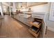 Custom cabinets with pull out drawers in this updated kitchen add smart storage to the home at 1808 S Sailors Way, Gilbert, AZ 85295