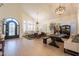 Bright and airy living room with soaring ceilings, wood floors, and stylish decor at 1808 S Sailors Way, Gilbert, AZ 85295