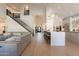 Bright living area features open floor plan, kitchen access, and high ceilings at 1808 S Sailors Way, Gilbert, AZ 85295