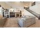 Open living space with stone fireplace, built-in shelving, and staircase at 1808 S Sailors Way, Gilbert, AZ 85295