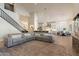 Bright and airy living space with hardwood floors, open staircase and views of the kitchen and dining area at 1808 S Sailors Way, Gilbert, AZ 85295