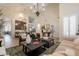 Spacious living area with open floorplan, contemporary furnishings, and wood-look flooring at 1808 S Sailors Way, Gilbert, AZ 85295