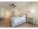 Hardwood flooring in main bedroom with a vanity area and a view to the ensuite at 1808 S Sailors Way, Gilbert, AZ 85295