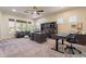 Large office featuring a ceiling fan, large windows, and a dark wood executive desk at 1808 S Sailors Way, Gilbert, AZ 85295