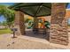 Community playground featuring a shaded picnic area with a grill and colorful slides for Gathering fun at 1808 S Sailors Way, Gilbert, AZ 85295