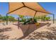 Community playground under shade with swings, slides, and play equipment for enjoyment and recreation at 1808 S Sailors Way, Gilbert, AZ 85295