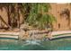 Beautiful pool featuring a rock waterfall with lush landscaping at 1808 S Sailors Way, Gilbert, AZ 85295