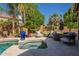 Backyard pool area with a spa, comfortable outdoor seating, and lush landscaping at 1808 S Sailors Way, Gilbert, AZ 85295