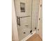 Modern glass shower with built-in niche and black hardware at 1808 S Sailors Way, Gilbert, AZ 85295