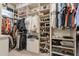 Spacious walk-in closet with custom shelving and ample storage for clothes, shoes, and accessories at 1808 S Sailors Way, Gilbert, AZ 85295