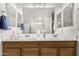 Bathroom with double sinks and vanity with a large mirror at 18903 N Shelby Dr, Maricopa, AZ 85138