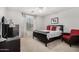 Bedroom with carpet, fan, window with blinds and curtains, and dark furniture at 18903 N Shelby Dr, Maricopa, AZ 85138