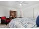 Bedroom with carpet, fan, and a floral pattern bed at 18903 N Shelby Dr, Maricopa, AZ 85138