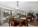 Dining area with backyard access and an open view into the living room at 18903 N Shelby Dr, Maricopa, AZ 85138