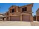 Beautiful home featuring a two-car garage, desert landscaping, and tile roof at 18903 N Shelby Dr, Maricopa, AZ 85138