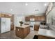 Functional kitchen with a kitchen island and neutral countertops at 18903 N Shelby Dr, Maricopa, AZ 85138