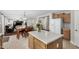 Open-concept view of the kitchen and dining area leading into the living room at 18903 N Shelby Dr, Maricopa, AZ 85138