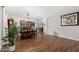 Spacious dining area featuring hardwood floors, chandelier, and large cabinet at 18903 N Shelby Dr, Maricopa, AZ 85138