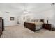 Spacious main bedroom with a ceiling fan, carpeted floors, and a large bed at 18903 N Shelby Dr, Maricopa, AZ 85138