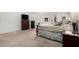 Spacious main bedroom with room for dressers, and an attached bath at 18903 N Shelby Dr, Maricopa, AZ 85138