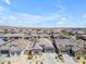 Aerial view of neighborhood featuring the property with solar panels on the roof at 18916 W Laurel Ln, Surprise, AZ 85388