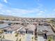 Aerial view of the neighborhood featuring scenic mountain views and desert landscaping at 18916 W Laurel Ln, Surprise, AZ 85388
