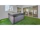 Relaxing hot tub room with turf and doors to the backyard at 18916 W Laurel Ln, Surprise, AZ 85388