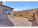 Private backyard featuring a unique brick patio and a custom brick wall at 18916 W Laurel Ln, Surprise, AZ 85388