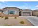 Charming single-story home featuring low-maintenance desert landscaping and a two-car garage at 18916 W Laurel Ln, Surprise, AZ 85388