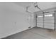 Spacious garage featuring a door for easy access to the house at 18916 W Laurel Ln, Surprise, AZ 85388