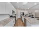 Modern kitchen with stainless steel appliances, granite countertops, and white cabinetry at 18916 W Laurel Ln, Surprise, AZ 85388